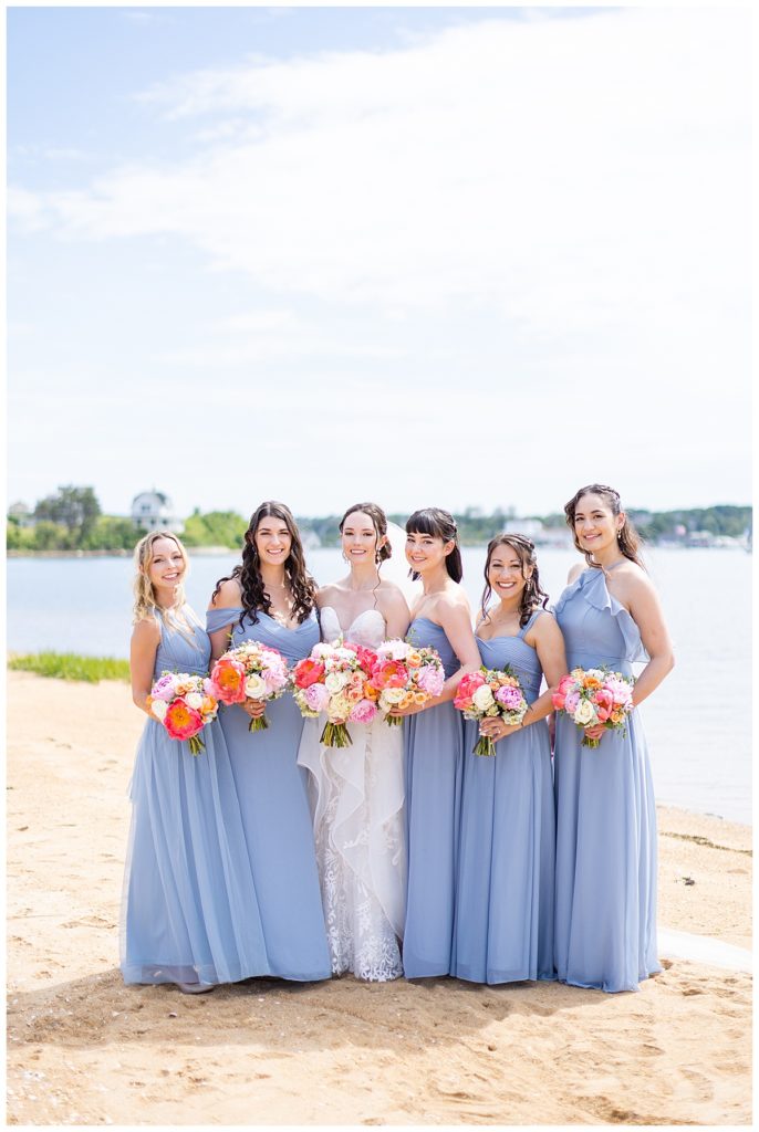 bride and wedding party posed on Block Island beach