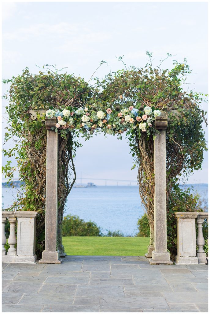 Ceremony site and arbor at Castle Hill Inn wedding venue overlooking the water.
