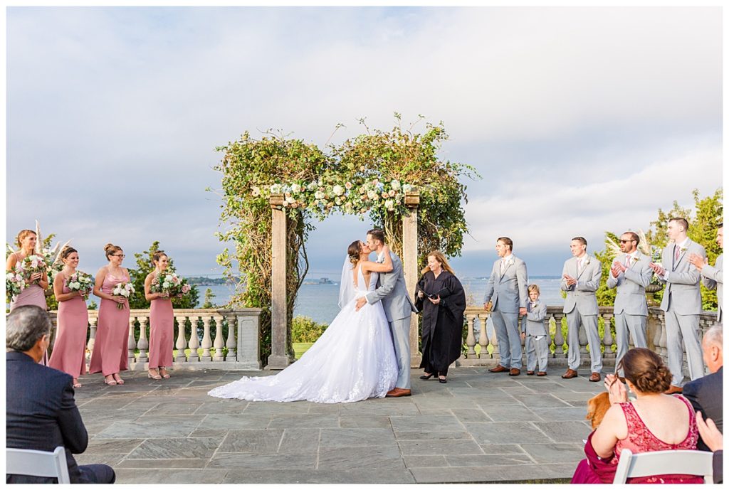 Bride and Groom kiss at their Castle Hill Inn wedding ceremony